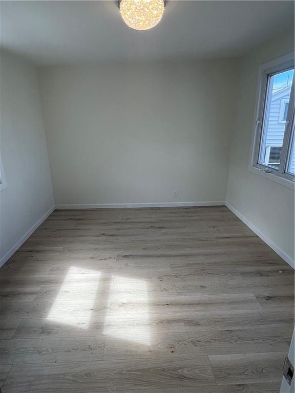 unfurnished room featuring light wood-type flooring