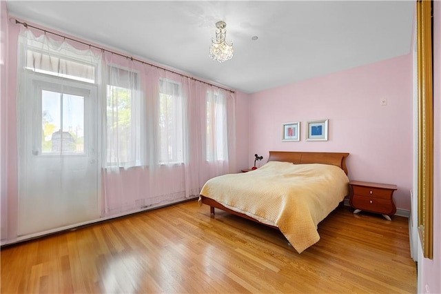 bedroom with hardwood / wood-style floors