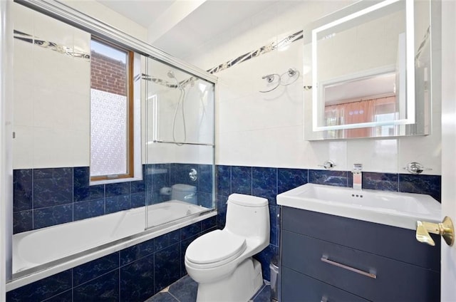 full bathroom featuring vanity, toilet, plenty of natural light, and enclosed tub / shower combo