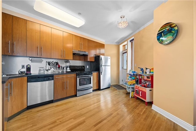 kitchen featuring light hardwood / wood-style floors and appliances with stainless steel finishes