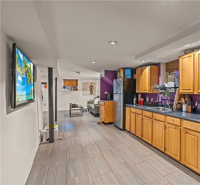 kitchen with sink and stainless steel refrigerator