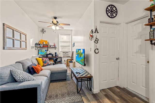 living room featuring cooling unit, ceiling fan, and dark hardwood / wood-style flooring