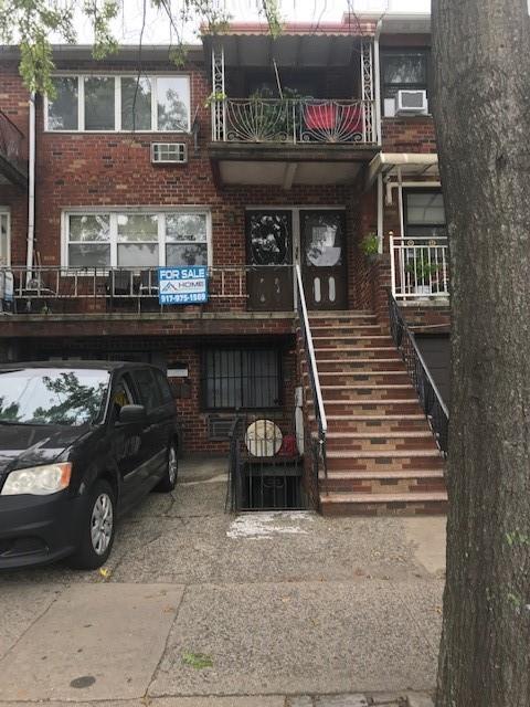 exterior space with stairway and brick siding