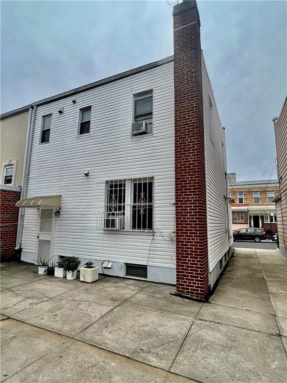 back of property with a patio and cooling unit