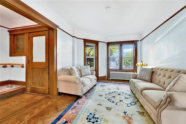 living room with parquet flooring and radiator