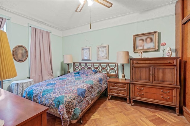 bedroom featuring light parquet flooring and ceiling fan