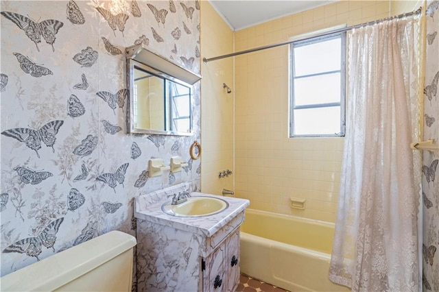 full bathroom featuring vanity, shower / bath combination with curtain, and toilet