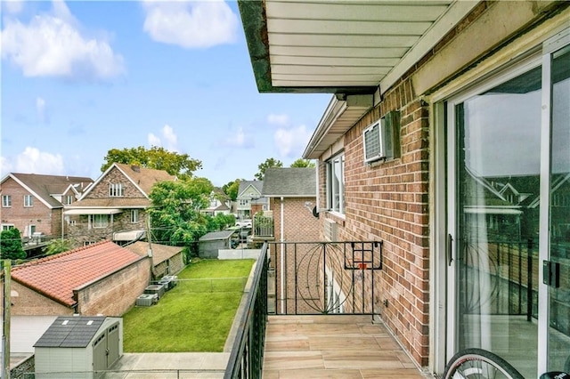 balcony featuring a wall unit AC