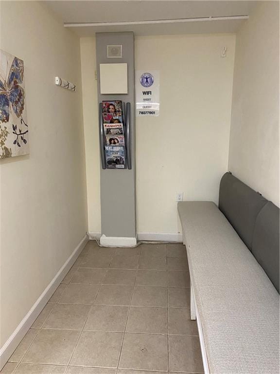 hall featuring tile patterned floors