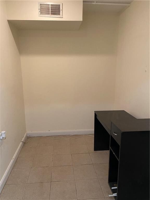 laundry room with light tile patterned floors