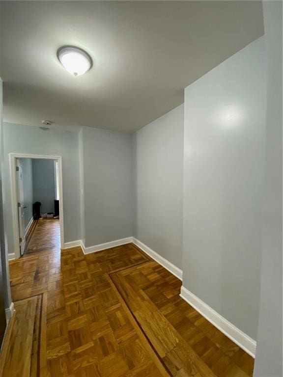 corridor featuring dark parquet floors