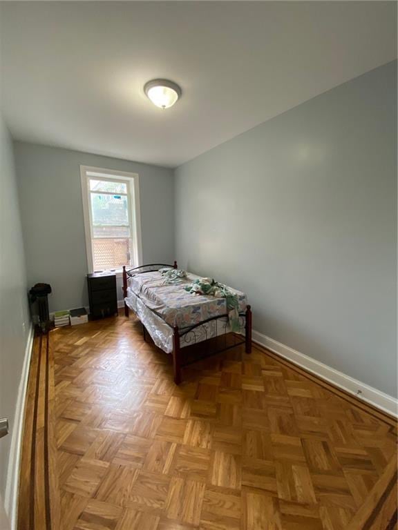 bedroom with parquet flooring