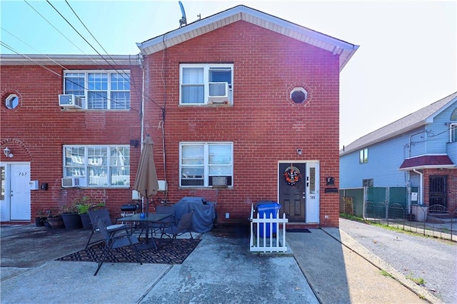 back of property with a patio area