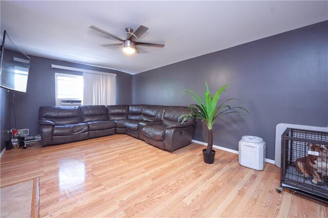 living room with ceiling fan and light hardwood / wood-style floors