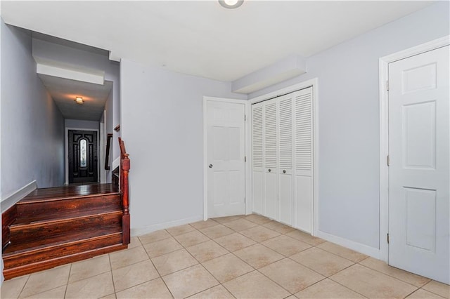 stairs with tile patterned flooring