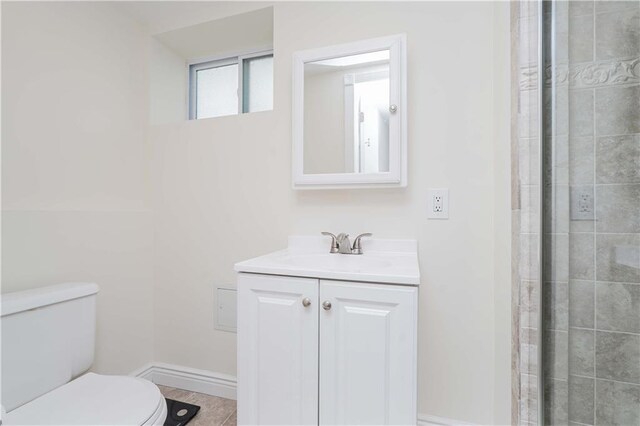 bathroom with toilet and vanity