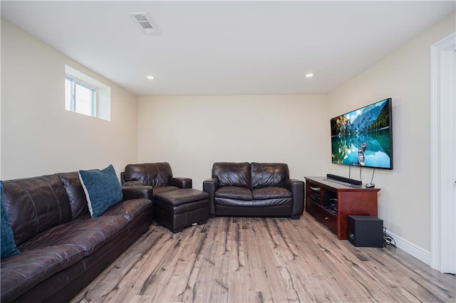 living room with light hardwood / wood-style flooring