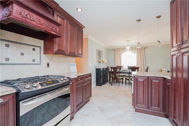 kitchen with premium range hood, pendant lighting, ornamental molding, stainless steel gas stove, and light stone counters