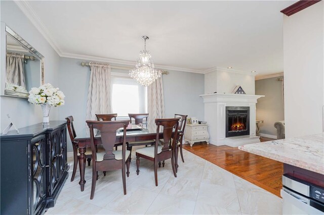 dining space with crown molding and a notable chandelier