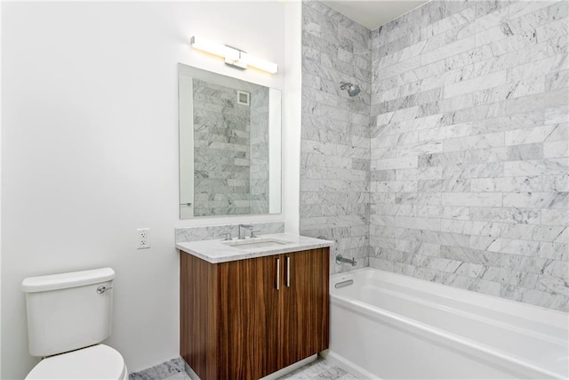 full bathroom with tiled shower / bath, vanity, and toilet