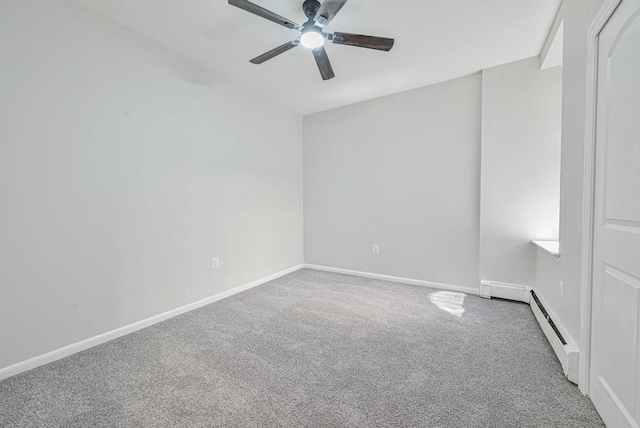 carpeted spare room with baseboards, a baseboard heating unit, and a ceiling fan