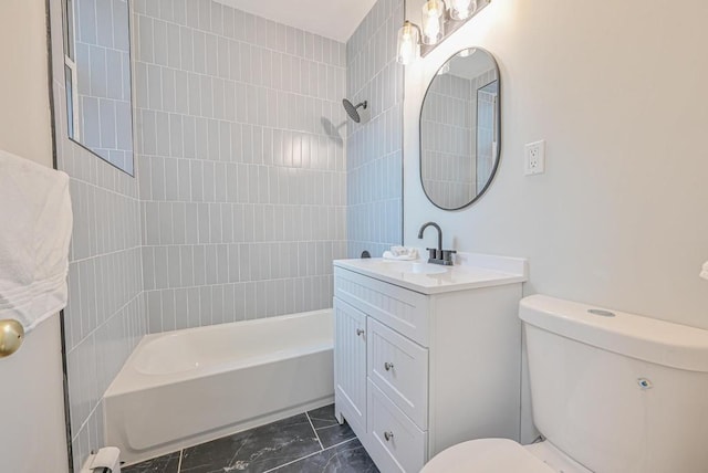 full bath with toilet, marble finish floor, bathtub / shower combination, and vanity