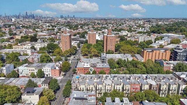 birds eye view of property featuring a city view
