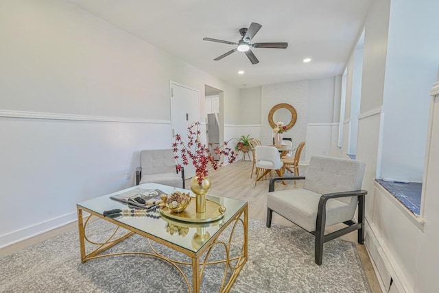 living area featuring recessed lighting, baseboards, ceiling fan, and wood finished floors