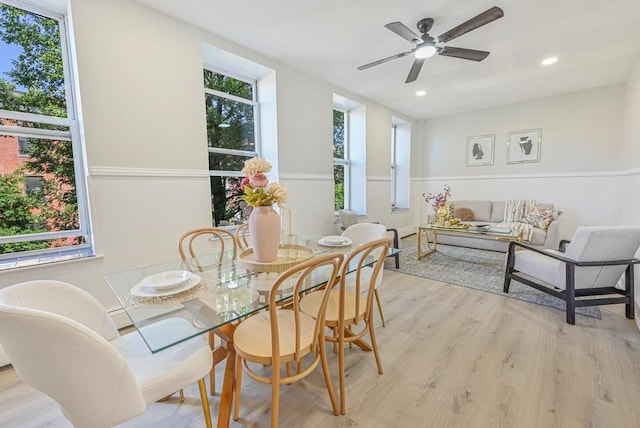 dining area featuring a ceiling fan, recessed lighting, and light wood-type flooring