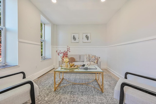 sitting room featuring recessed lighting, a baseboard heating unit, and wood finished floors