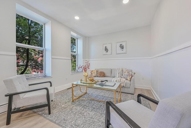 interior space with recessed lighting, wood finished floors, and baseboards