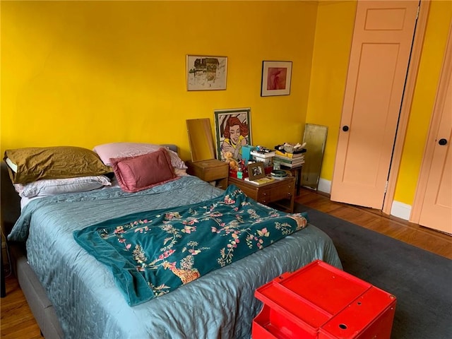 bedroom featuring wood-type flooring