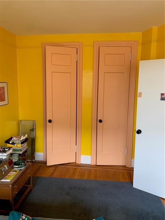 bedroom with wood-type flooring