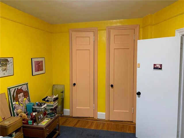 interior space with dark hardwood / wood-style flooring