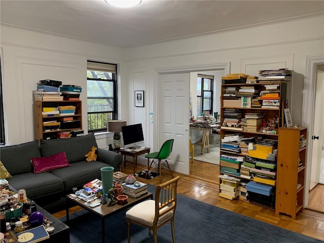 living room with parquet flooring