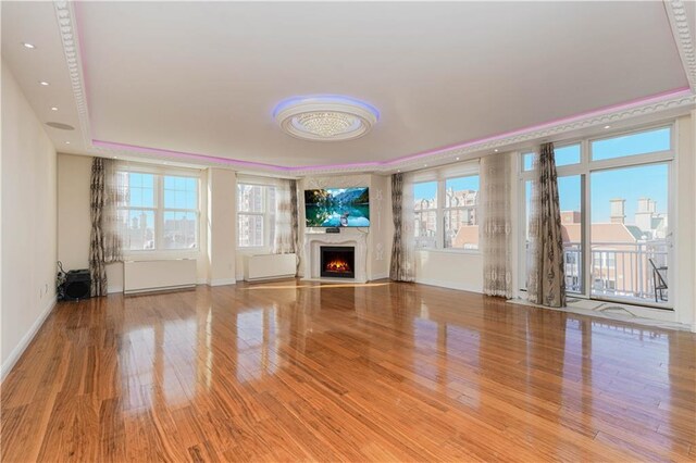 unfurnished living room featuring light hardwood / wood-style floors