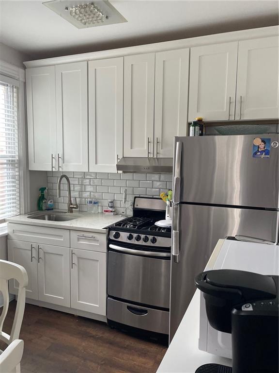 kitchen featuring white cabinetry, sink, and stainless steel appliances