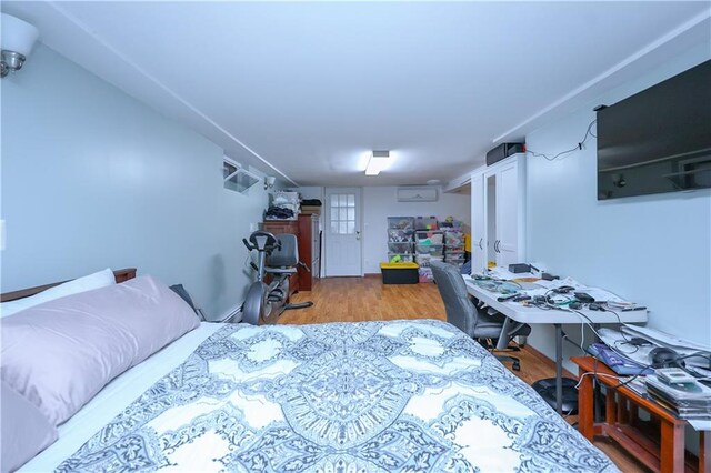 bedroom featuring wood-type flooring