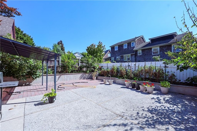 exterior space with a patio area and fence