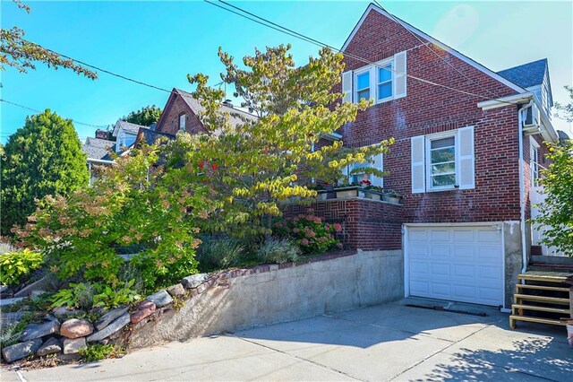 view of property exterior with a garage