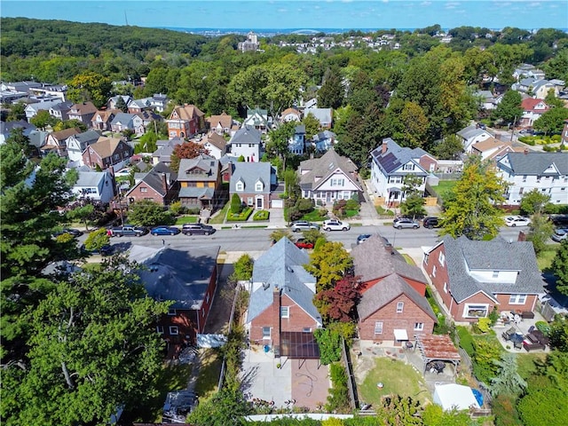 birds eye view of property featuring a residential view and a forest view