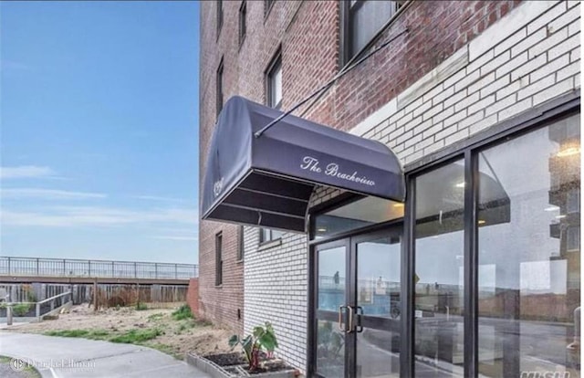 view of property exterior with brick siding