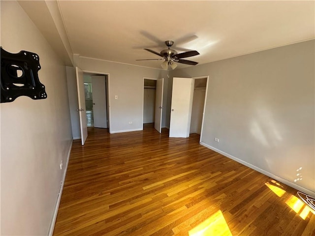 unfurnished bedroom featuring hardwood / wood-style floors and ceiling fan