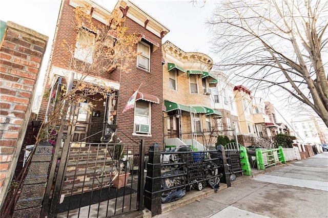 view of building exterior featuring a fenced front yard