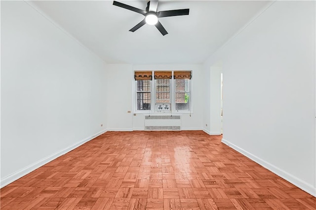 9430 Ridge Blvd Unit 1F, Brooklyn, NY 11209 - empty room featuring radiator heating unit, a ceiling fan, and baseboards