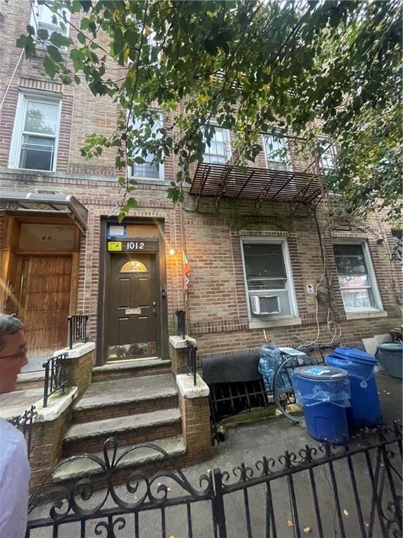 doorway to property featuring cooling unit