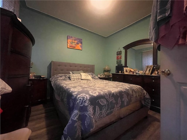 bedroom featuring dark hardwood / wood-style flooring