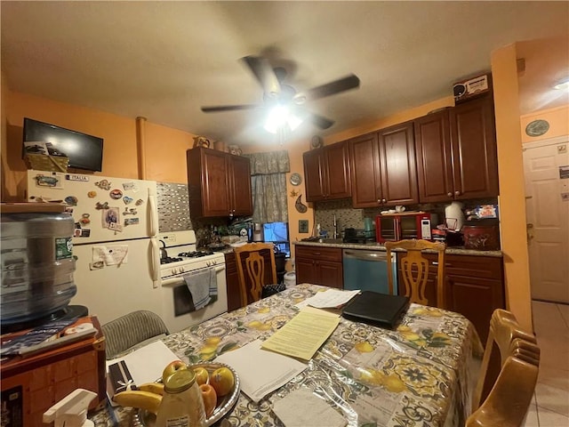 kitchen featuring decorative backsplash, ceiling fan, light tile patterned floors, and white appliances