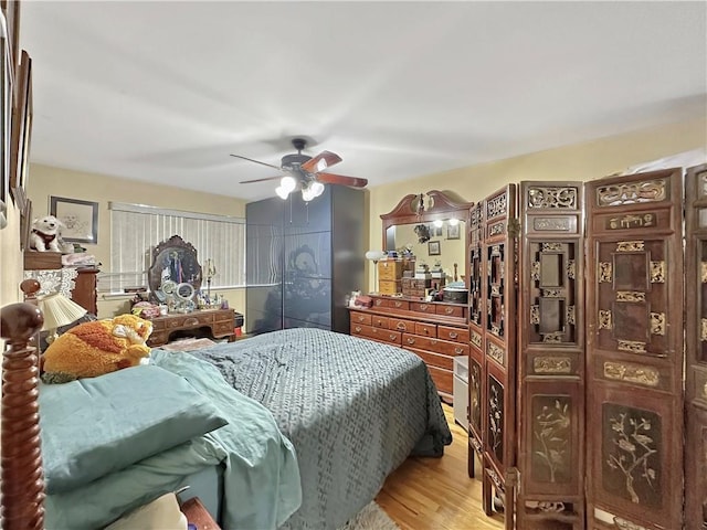 bedroom featuring light wood-type flooring and ceiling fan