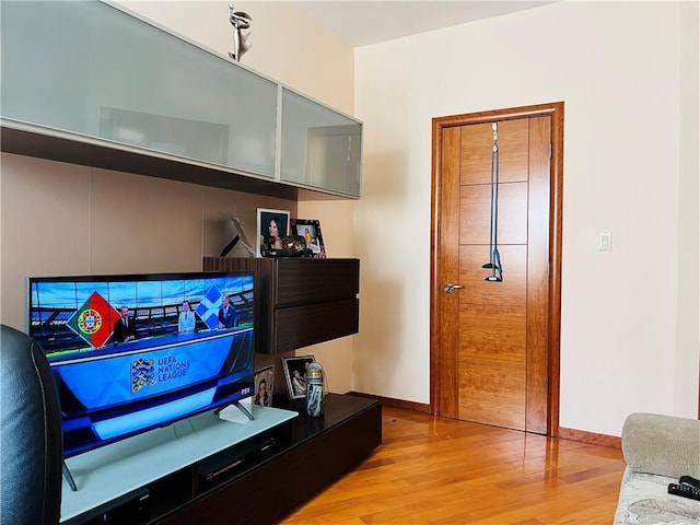 living room with light hardwood / wood-style flooring